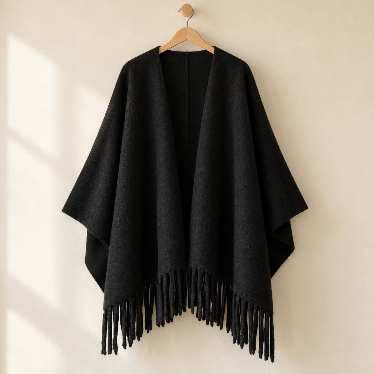 The Cherish Company — Tassel-Trimmed Drape Wrap in Black
