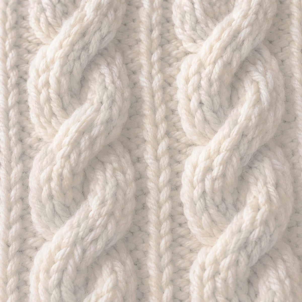 Over-knee stockings in chunky cable knit